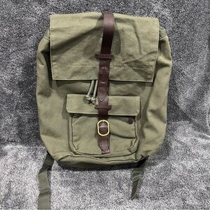 Vintage-style army green canvas rucksack backpack with laptop sleeve unisex